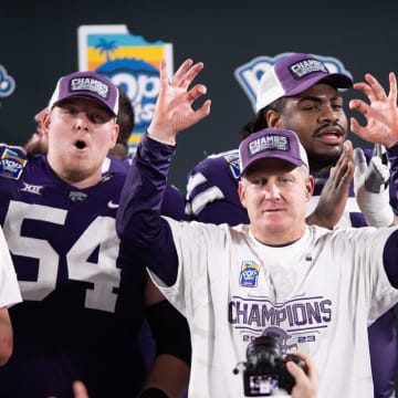 Dec 28, 2023; Orlando, FL, USA; Kansas State head coach Chris Klieman celebrates the victory over NC State after the game at Camping World Stadium. Mandatory Credit: Jeremy Reper-USA TODAY Sports