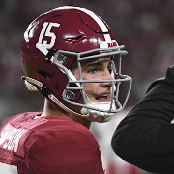 Simpson (left) has fumbled the ball off of a sack in five straight games, prompting a stern message from his coach, DeBoer (right). 