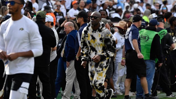 Sep 30, 2023; Boulder, Colorado, USA; Former wide receiver Terrell Owens runs not he field prior to the gam with the Colorado