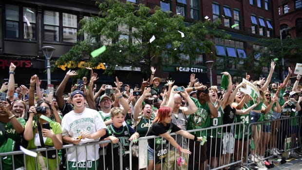 Fans cheer during the Boston Celtics 2024 NBA championship parade. 