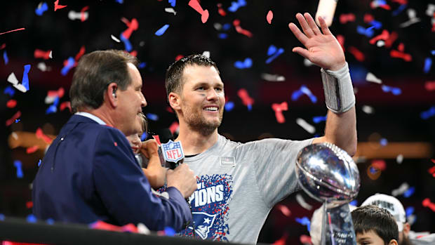 New England Patriots quarterback Tom Brady (12) with the Vince Lombardi Trophy after winning Super Bowl LIII.