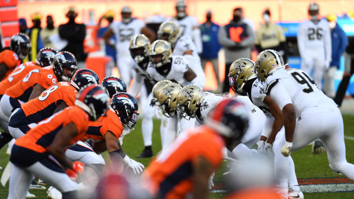 Nov 29, 2020; Denver, Colorado, USA; Members of the New Orleans Saints line up against the Denver Broncos in the second quarter at Empower Field at Mile High. Mandatory Credit: Ron Chenoy-USA TODAY Sports
