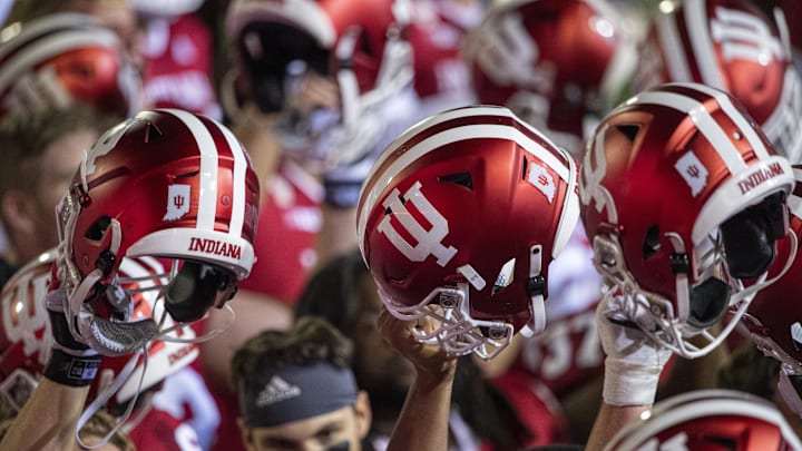 Oct 24, 2020; Bloomington, Indiana, USA;  Indiana Hoosiers raise their helmets after the game at Memorial Stadium. The Indiana Hoosiers defeated the Penn State Nittany Lions 36 to 35.  Mandatory Credit: Marc Lebryk-Imagn Images
