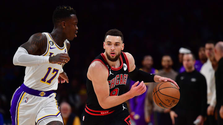 Mar 26, 2023; Los Angeles, California, USA; Chicago Bulls guard Zach LaVine (8) moves the ball up court against Los Angeles Lakers guard Dennis Schroder (17) during the second half at Crypto.com Arena. Mandatory Credit: Gary A. Vasquez-USA TODAY Sports