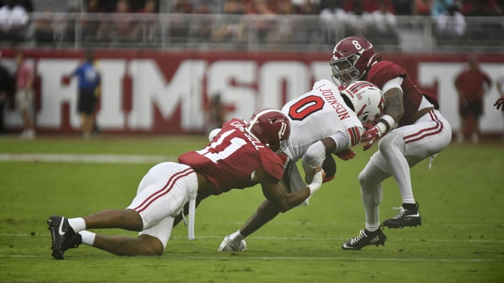 Aug 31, 2024; Tuscaloosa, Alabama, USA;  Alabama Crimson Tide linebacker Jihaad Campbell (11) and defensive back DeVonta Smith (8) combine to stop Western Kentucky Hilltoppers Kisean Johnson (0) during the first half at Bryant-Denny Stadium. Mandatory Credit: Gary Cosby Jr.-USA TODAY Sports