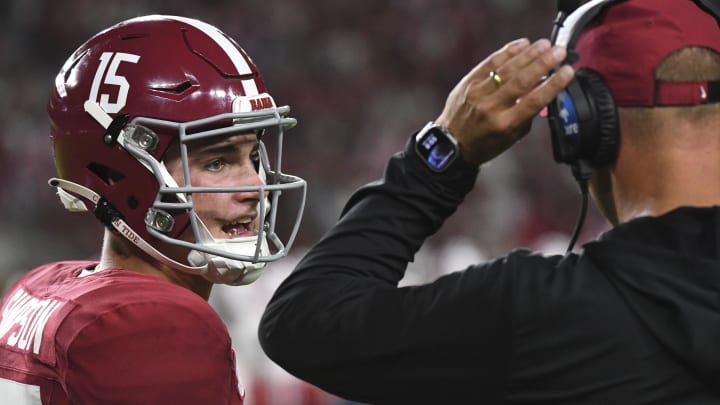 Aug 31, 2024; Tuscaloosa, Alabama, USA;  Alabama Crimson Tide quarterback Ty Simpson (15) talks with Alabama Crimson Tide head coach Kalen DeBoer  at Bryant-Denny Stadium during the game between the Alabama Crimson Tide and the Western Kentucky Hilltoppers. Alabama defeated Western Kentucky 63-0. 