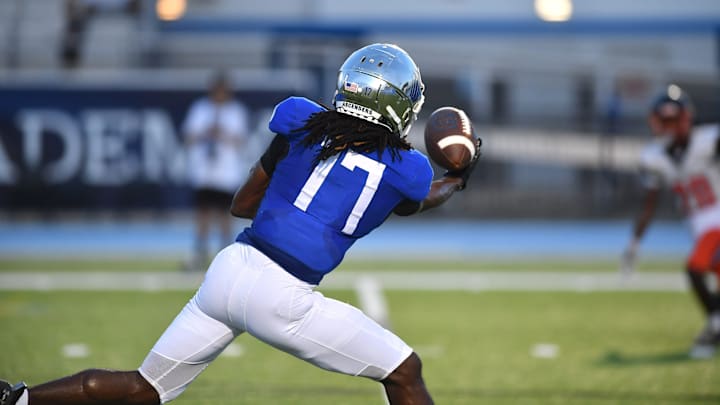 IMG Academy wide receiver Adonis Moise (#17) pulls in a pass with one hand before carrying the ball into the end zone. The IMG Academy National squad hosted the Cocoa High School Tigers Friday, Sept. 6, 2024 in Bradenton.