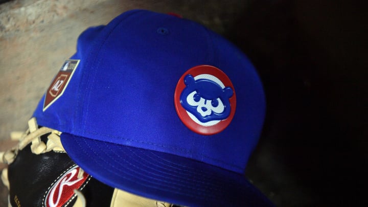 Mar 24, 2018; Peoria, AZ, USA; A Chicago Cubs cap sits on the dugout steps during the second inning of the game against the Seattle Mariners at Peoria Sports Complex. 