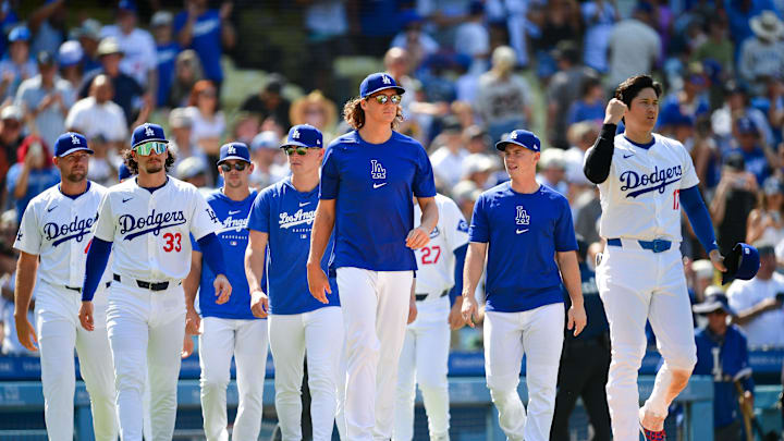 Jul 25, 2024; Los Angeles, California, USA; Los Angeles Dodgers pitcher Blake Treinen (49) outfielder James Outman (33) pitcher Gavin Stone (35) pitcher River Ryan (70) pitcher Tyler Glasnow (31) catcher Will Smith (16) and designated hitter Shohei Ohtani (17) celebrate the victory against the San Francisco Giants at Dodger Stadium. Mandatory Credit: Gary A. Vasquez-Imagn Images