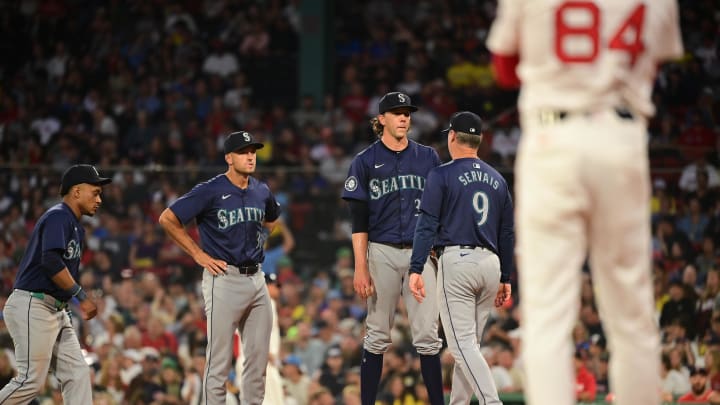 Seattle Mariners manager Scott Servais (9) relives starting pitcher Logan Gilbert (36) of the ball during the third inning against the Boston Red Sox at Fenway Park on July 29.