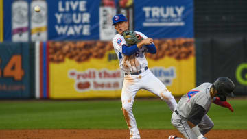 Tennessee Smokies' infielder James Triantos (6) throws the ball to first base after getting an out at second base during the last opening day game at the Tennessee Smokies Stadium on Friday, April 5, 2024 in Kodak, Tenn.