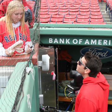 May 12, 2024; Boston, Massachusetts, USA;  Boston Red Sox first baseman Triston Casas speaks to a fan before a game against the Washington Nationals at Fenway Park.