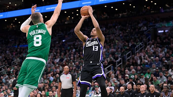 Apr 5, 2024; Boston, Massachusetts, USA; Sacramento Kings forward Keegan Murray (13) shoots the ball over Boston Celtics center Kristaps Porzingis (8).