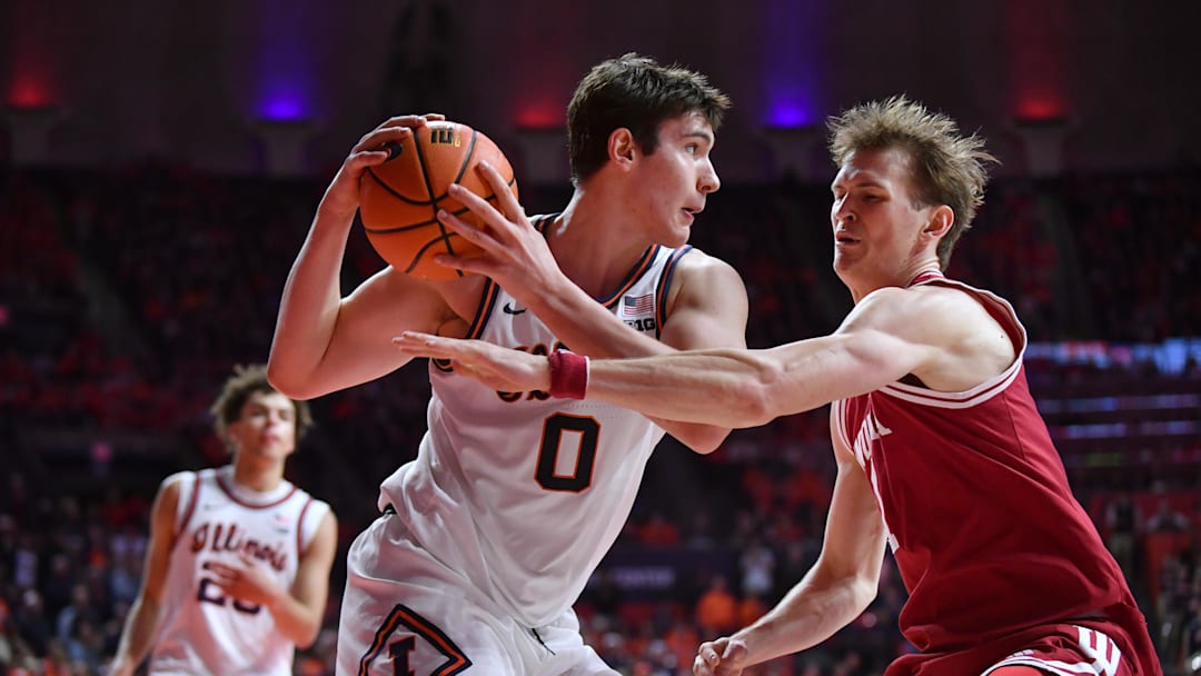 Feb 15, 2026; Champaign, Illinois, USA;  Illinois Fighting Illini forward David Mirkovic (0) looks to pass as Indiana Hoosiers forward Reed Bailey (1) defends during the second half at State Farm Center. Mandatory Credit: Ron Johnson-Imagn Images