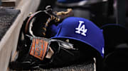 May 13, 2017; Denver, CO, USA; General view the Los Angeles Dodgers cap and glove during the ninth inning against the Colorado Rockies at Coors Field. Mandatory Credit: Ron Chenoy-Imagn Images