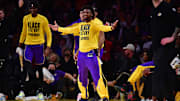 Los Angeles Lakers guard Bronny James reacts after forward LeBron James scores a three point basket against the Golden State Warriors during the first half at Crypto.com Arena. 