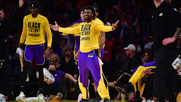 Los Angeles Lakers guard Bronny James reacts after forward LeBron James scores a three point basket against the Golden State Warriors during the first half at Crypto.com Arena. 