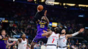Jan 19, 2025; Inglewood, California, USA; Los Angeles Lakers forward LeBron James (23) shoots against Los Angeles Clippers guard James Harden (1) and guard Amir Coffey (7) during the second half at Intuit Dome. Mandatory Credit: Gary A. Vasquez-Imagn Images