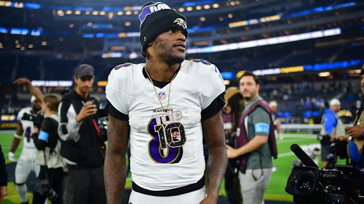 Nov 25, 2024; Inglewood, California, USA; Baltimore Ravens quarterback Lamar Jackson (8) reacts following the victory against the Los Angeles Chargers at SoFi Stadium. Mandatory Credit: Gary A. Vasquez-Imagn Images