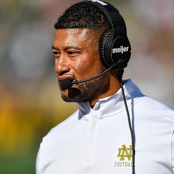 Sep 7, 2024; South Bend, Indiana, USA; Notre Dame Fighting Irish head coach Marcus Freeman walks to the sideline in the second quarter against the Northern Illinois Huskies at Notre Dame Stadium. Mandatory Credit: Matt Cashore-Imagn Images