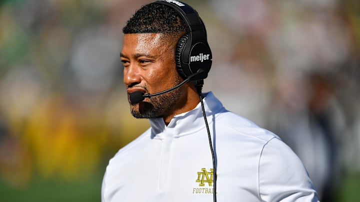 Sep 7, 2024; South Bend, Indiana, USA; Notre Dame Fighting Irish head coach Marcus Freeman walks to the sideline in the second quarter against the Northern Illinois Huskies at Notre Dame Stadium. Mandatory Credit: Matt Cashore-Imagn Images