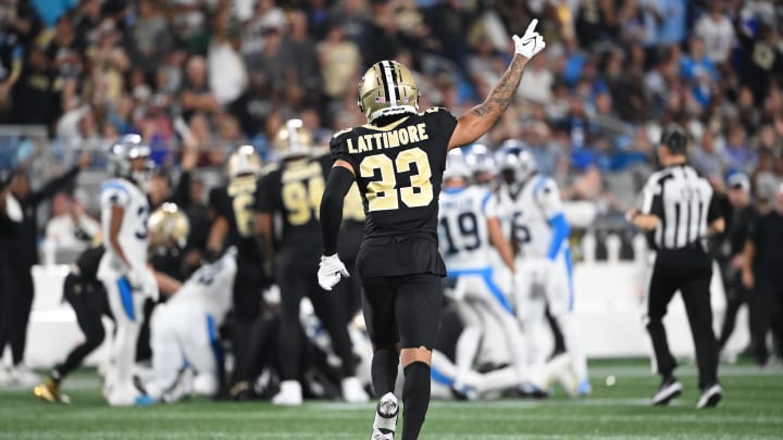 Sep 18, 2023; Charlotte, North Carolina, USA; New Orleans Saints cornerback Marshon Lattimore (23) signals a turnover by Carolina Panthers in the second quarter at Bank of America Stadium. Mandatory Credit: Bob Donnan-USA TODAY Sports