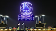 A Los Angeles Dodgers 2024 World Series Champion ring is projected during a drone show at Dodger Stadium. 