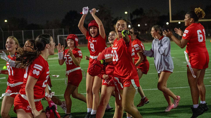 Mater Dei girls flag football celebrates after stunning previously unbeaten Orange Lutheran during the 2024 season.