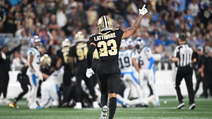 Sep 18, 2023; Charlotte, North Carolina, USA; New Orleans Saints cornerback Marshon Lattimore (23) signals a turnover by Carolina Panthers in the second quarter at Bank of America Stadium. Mandatory Credit: Bob Donnan-Imagn Images