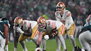 Dec 3, 2023; Philadelphia, Pennsylvania, USA; San Francisco 49ers center Jake Brendel (64) snaps the ball to quarterback Brock Purdy (13) against the Philadelphia Eagles at Lincoln Financial Field. Mandatory Credit: Eric Hartline-Imagn Images