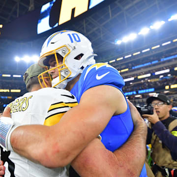 Nov 9, 2025; Inglewood, California, USA; Pittsburgh Steelers quarterback Aaron Rodgers (8) hugs Los Angeles Chargers quarterback Justin Herbert (10) after the game at SoFi Stadium. Mandatory Credit: Gary A. Vasquez-Imagn Images