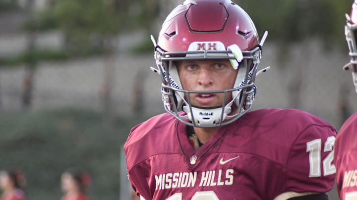 Mission Hills junior quarterback Troy Huhn warms up prior to the 2024 season opener. The Grizzlies beat Carlsbad 35-28 on Friday. 