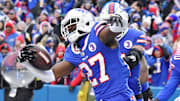 Bills cornerback Tre'Davious White reacts to intercepting a pass against the Patriots in 2023.