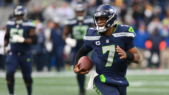 Dec 31, 2023; Seattle, Washington, USA; Seattle Seahawks quarterback Geno Smith (7) carries the ball against the Pittsburgh Steelers during the second half at Lumen Field.