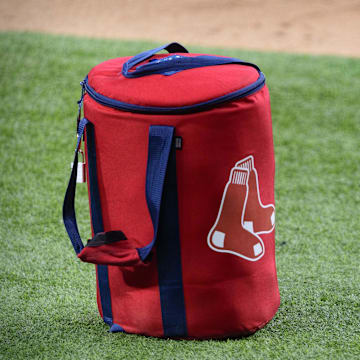 Apr 29, 2021; Arlington, Texas, USA; A view of the Boston Red Sox logo and a field bag during batting practice before the game between the Texas Rangers and the Boston Red Sox at Globe Life Field. Mandatory Credit: Jerome Miron-Imagn Images