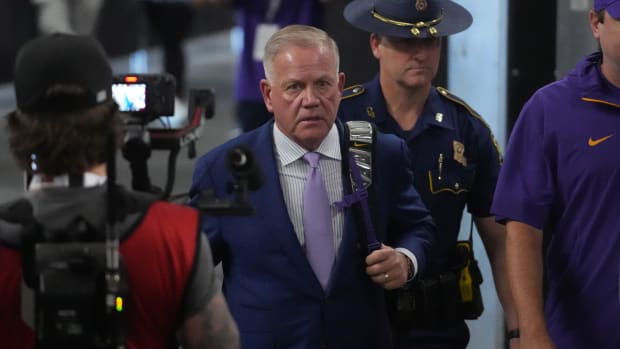 LSU Tigers coach Brian Kelly arrives before the game against the Southern California Trojans  at Allegiant Stadium. 