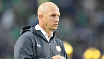 Sep 29, 2018; South Bend, IN, USA; Notre Dame Fighting Irish defensive coordinator Clark Lea watches warmups before the game against the Stanford Cardinal at Notre Dame Stadium. 