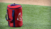 Apr 29, 2021; Arlington, Texas, USA; A view of the Boston Red Sox logo and a field bag during batting practice before the game between the Texas Rangers and the Boston Red Sox at Globe Life Field. Mandatory Credit: Jerome Miron-Imagn Images