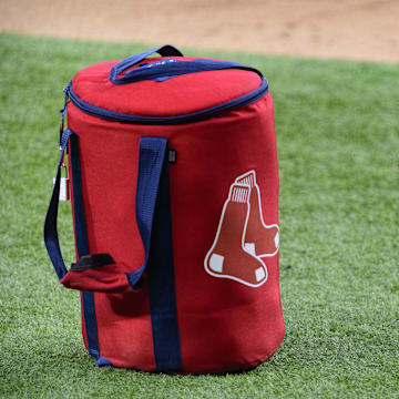 Apr 29, 2021; Arlington, Texas, USA; A view of the Boston Red Sox logo and a field bag during batting practice before the game between the Texas Rangers and the Boston Red Sox at Globe Life Field. Mandatory Credit: Jerome Miron-Imagn Images