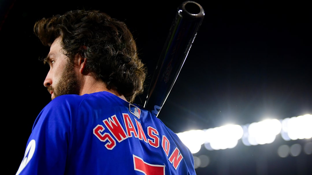 Sep 9, 2024; Los Angeles, California, USA; Chicago Cubs shortstop Dansby Swanson (7) on deck before hitting against the Los Angeles Dodgers during the fourth inning at Dodger Stadium