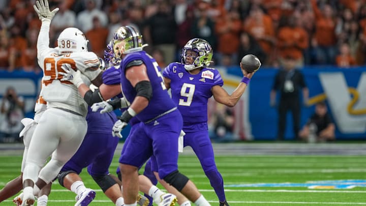 Dec 29, 2022; San Antonio, Texas, USA; Washington Huskies quarterback Michael Penix Jr. (9) throws a pass against the Texas Longhorns in the 2022 Alamo Bowl at the Alamodome. Mandatory Credit: Daniel Dunn-Imagn Images