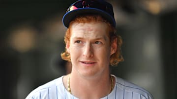 Sep 13, 2025; Chicago, Illinois, USA; Chicago Cubs right fielder Owen Caissie (19) looks on from the dugout prior to a game against the Tampa Bay Rays at Wrigley Field. 