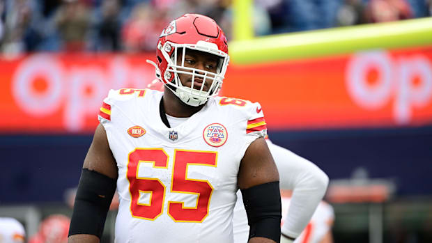 Kansas City Chiefs guard Trey Smith (65) warms up before a game
