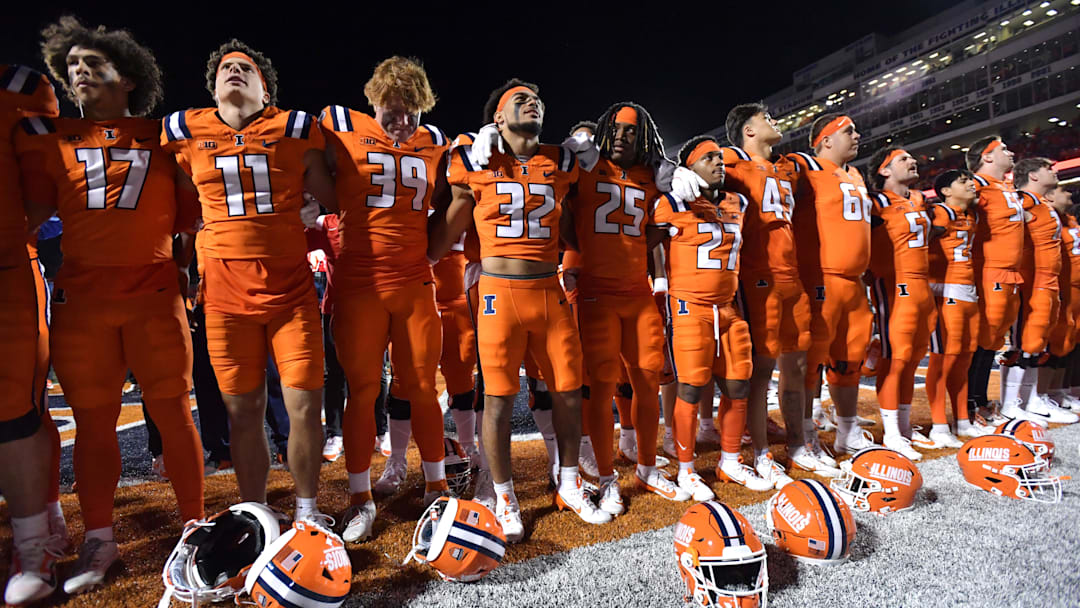 Sep 7, 2024; Champaign, Illinois, USA; Illinois Fighting Illini players celebrate their win over the Kansas Jayhawks  at Memorial Stadium. Mandatory Credit: Ron Johnson-Imagn Images
