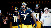 Sep 6, 2025; Columbia, Missouri, USA; Missouri Tigers defensive tackle Chris McClellan leads the defensive linemen onto the field for the Border War between the Tigers and Kansas Jayhawks at Faurot Field at Memorial Stadium.