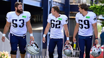 Aug 3, 2023; Foxborough, MA, USA; New England Patriots center Jake Andrews (53) chats with place kicker Chad Ryland (62) and punter Bryce Baringer (59) on their way to the practice fields  at training camp at Gillette Stadium.  Mandatory Credit: Eric Canha-Imagn Images