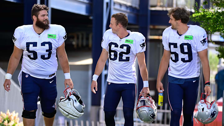 Aug 3, 2023; Foxborough, MA, USA; New England Patriots center Jake Andrews (53) chats with place kicker Chad Ryland (62) and punter Bryce Baringer (59) on their way to the practice fields  at training camp at Gillette Stadium.  Mandatory Credit: Eric Canha-Imagn Images