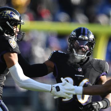 Dec 24, 2022; Baltimore, Maryland, USA; Baltimore Ravens cornerback Marlon Humphrey (44) celebrates with safety Kyle Hamilton (14) after a tackle during the first half against the Atlanta Falcons at M&T Bank Stadium. Mandatory Credit: Tommy Gilligan-USA TODAY Sports