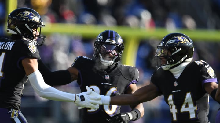 Dec 24, 2022; Baltimore, Maryland, USA; Baltimore Ravens cornerback Marlon Humphrey (44) celebrates with safety Kyle Hamilton (14) after a tackle during the first half against the Atlanta Falcons at M&T Bank Stadium. Mandatory Credit: Tommy Gilligan-USA TODAY Sports