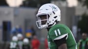 Lincoln's Akili Smith Jr. warms up during a 2023 regular season game